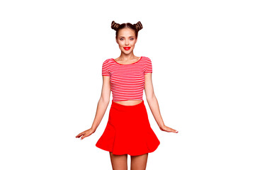 Sticker - Adorable fancy young girl wear in red skirt and striped tshirt stand upright look at the camera isolated on red backgroung