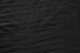 Fototapeta  - Black crumpled fabric. Background texture.