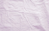 Fototapeta  - Top view of wrinkles on an unmade bed sheet after waking up in the morning.