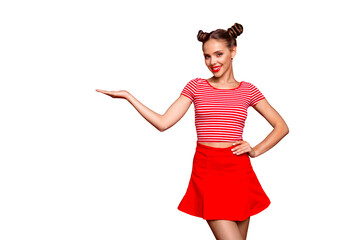 Poster - Recommend advertising concept. Portrait of young cute brunette lady holding and demonstrate invisible product on hand isolated on red background with copyspace