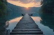 Sunset over a calm lake on a wooden pier