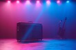 A guitar amplifier is sitting on a stage in front of a purple and blue wall