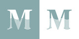 Fototapeta Do przedpokoju - Logo Nautical. Letra inicial M con olas de mar