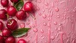 Fresh red cherries on a pink background with water drops, closeup. Copy space. Top view.