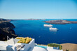 View with cruise ships of the volcanic caldera of Nea Kameni from the village of Thira (Fira), Santorini Island, Cyclades, Greece