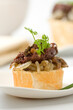 Black pudding pintxo with mushrooms and onion. Spanish tapas in the Basque Country...
