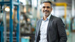 © photo for everything - Portrait of a factory owner or manager in a business suit background warehouse. Banner industrial plant process
