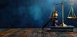 © Penatic Studio - Concept for law firm business with copy space. Scales of justice on wooden table in dark blue background.