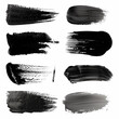 Black and white makeup brush strokes on white background.