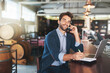 Business owner, restaurant and portrait of man with phone call for planning, communication or info. Male person, pub and notebook with technology for inventory, stock update or feedback from supplier