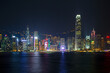 Banking district of Hong Kong illuminated at dusk with Ferris wheel