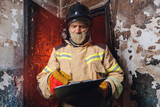 Fototapeta  - Fireman inspector conducts investigation to determine circumstances of fire in house and uses clipboard for report incident. Concept Insurance payments and checklist