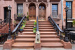 Brownstones with stoop steps in Chelsea Historic District. Row of Townhouses Manhattan, New York City