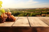 Fototapeta Tulipany - Empty wooden table top with grape and blurred background with field of vineyard. Mock up for wine product display.
