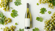 bottle of riesling wine framed by riesling wine grapes and leafs standing on a white table with smooth white backdrop