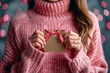 Young Woman in Pink Knit Sweater Holding Craft Gift Tag with Ribbon