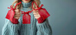Woman in Cozy Sweater Holding Festive Red Gift Tags with Snowflakes, Sales Concept