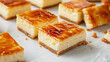Glazed curd cheese bars on white table closeup