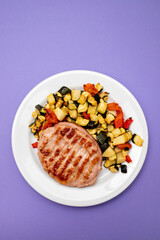 Wall Mural - Delicious grilled chicken burgers served with baked vegetables