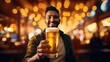 A cheerful man is toasting with a beer in a warmly lit pub