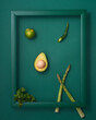 Chili pepper, avocado, asparagus, lime and mint in frame