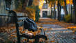 A school bag placed on a bench in a tranquil school courtyard, surrounded by autumn leaves.