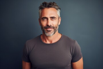 Portrait of a cheerful man in his 40s donning a trendy cropped top in front of modern minimalist interior