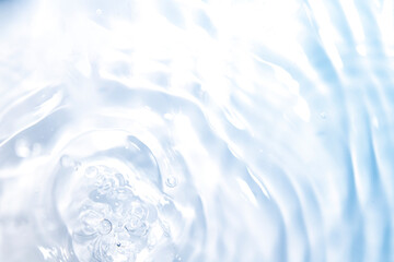 Wall Mural - the clear blue surface of the water gradients from light to dark.