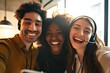 Photograph depicts a diverse group of joyful, smiling contact center telemarketing agents taking office selfies. Confident and ambitious colleagues dedicated to excellent customer service