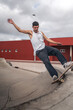 young man skating a ramp in a skate park