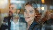 © Wattana - A teamwork concept image featuring a businesswoman and a businessman in a meeting, with a view through glass emphasizing transparency.
