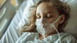 © AlfaSmart - Young patient with a touching photograph of a girl wearing an oxygen mask