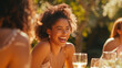 Joyful Outdoor Gathering: Smiling Afro-American Woman with Curly Hair at Sunset Dinner Party