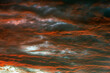Beautiful view of sunset sky after sun has gone below the horizon. Only the sky above the horizon. Cirrus low clouds. Dramatic sunset. Fantastic dark blue thunderclouds at sunset, Natural composition.
