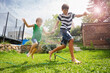 © Sergey Novikov - Kids immersed in water game on open air, with sunny backyard
