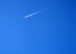 Sharp telephoto close-up of jet plane aircraft with contrails 