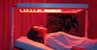 © YanabY - Revitalizing light therapy session: close-up of a person undergoing a rejuvenating red light treatment