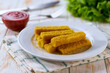 Fried fish sticks. Crispy Fish fingers with lemon and sauce ready to eat.