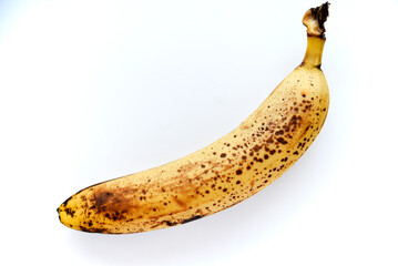 Overripe bananas on a white background. Ripe yellow fruit.