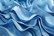 The image is of a blue fabric with a wave pattern