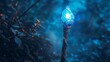 A blue crystal staff glowing in a dark forest