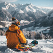 A serene image of a snowboarder sitting on a snowbank their colorful snowboard propped up next to them