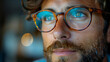 © LARTs Studio - Close-up of a man with glasses, emphasizing thoughtful contemplation and intellectual style, suitable for lifestyle and eyewear promotions. For eyewear advertisements and personal growth content.