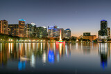 Fototapeta Miasta - Orlando city skyline at night in Lake Eola, Orlando, Florida, USA