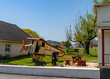 Playful setting in Amish country with a handcrafted playground model and picnic area against a backdrop of budding trees. High quality photo. Lancaster, Pennsylvania, USA
