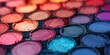 A close-up view of various vibrant eyeshadow palettes, highlighting their rich textures and colors in makeup..