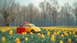 Toy car carrying present in vibrant tulip field, perfect for gift-giving concepts