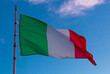 Image of national flag of Italy waving against blue sky