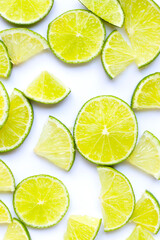 Wall Mural - Fresh lime slices on white background.