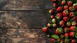 Fresh strawberries scattered on rustic wooden table